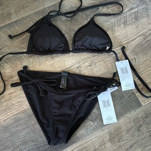 Never been worn matching black hurley bikini top and bottom woman’s small